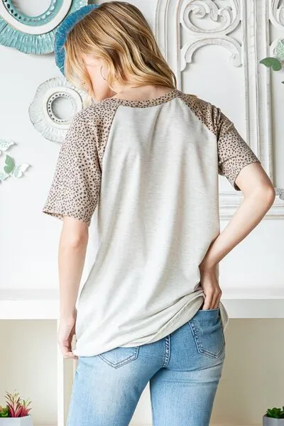 Full Size Animal Print Half Button Short Sleeve Top